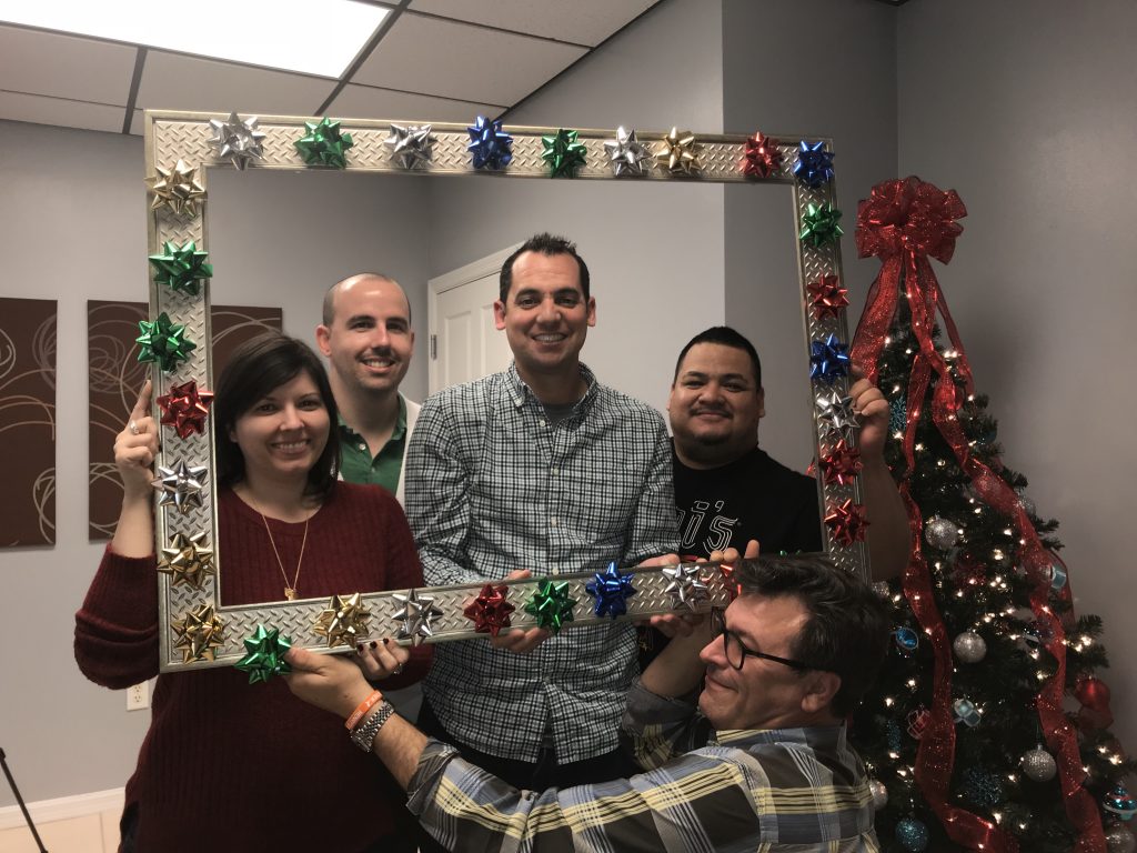 employees posing in christmas scene