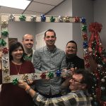 employees posing in christmas scene