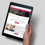 hand holding tablet showing one of the web sites we built