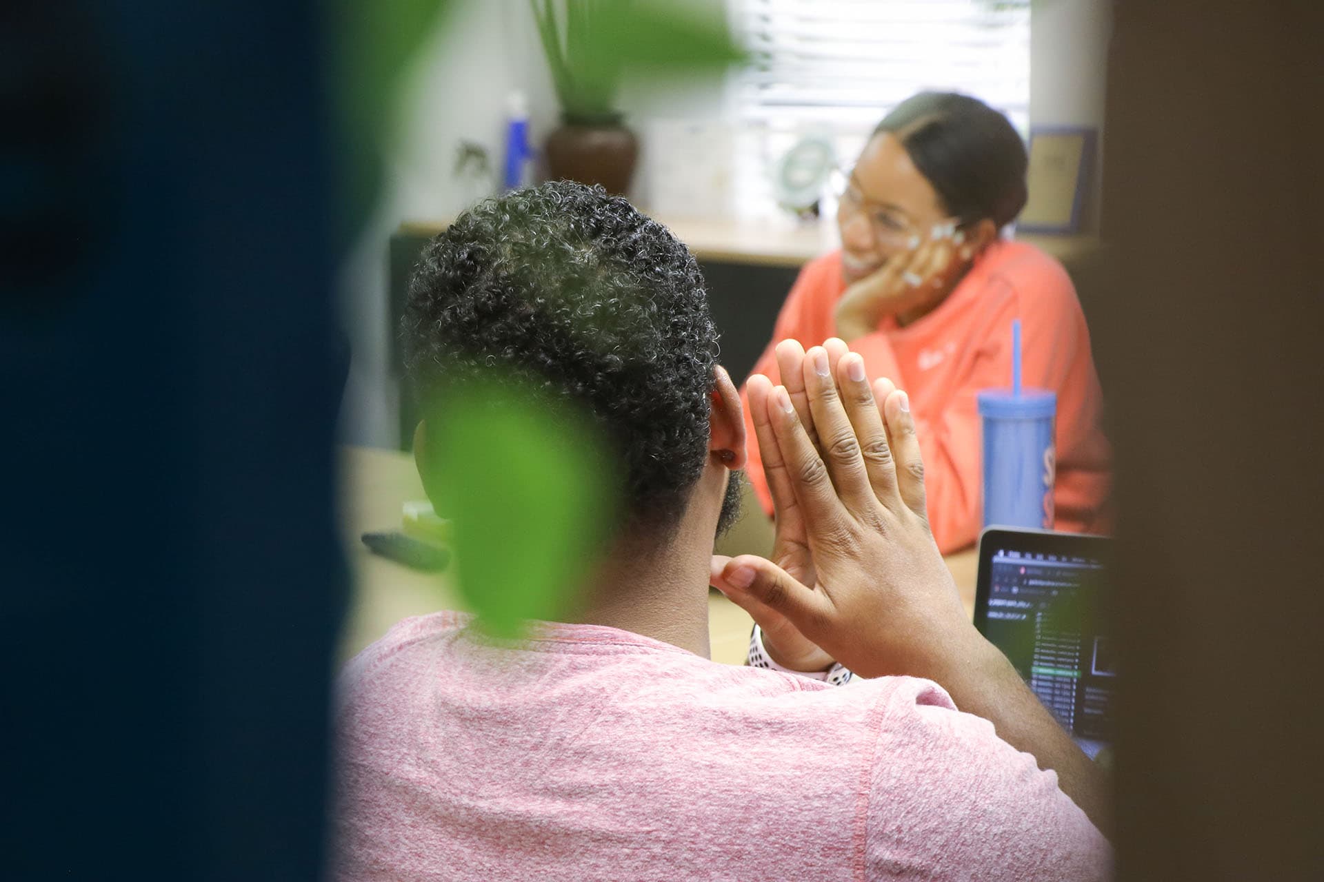 Photo of people taking a meeting.