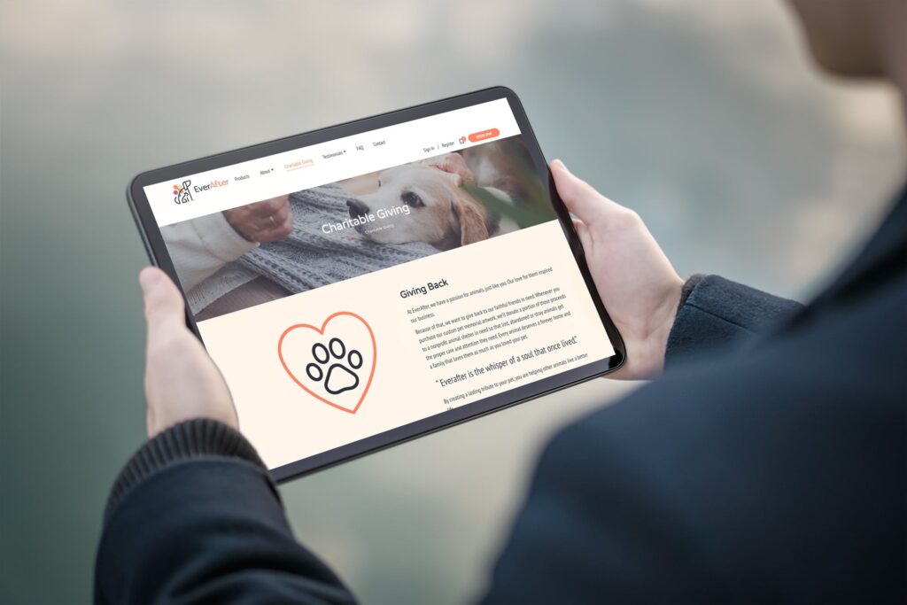 Man viewing Ever After website on tablet outdoors